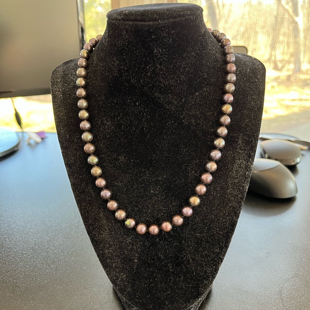 Purple metallic beaded necklace with hook and eye closure.